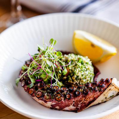 Served octopus with garnish.