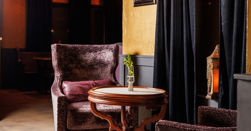Interior, two comfy tufted armchairs and a coffee table