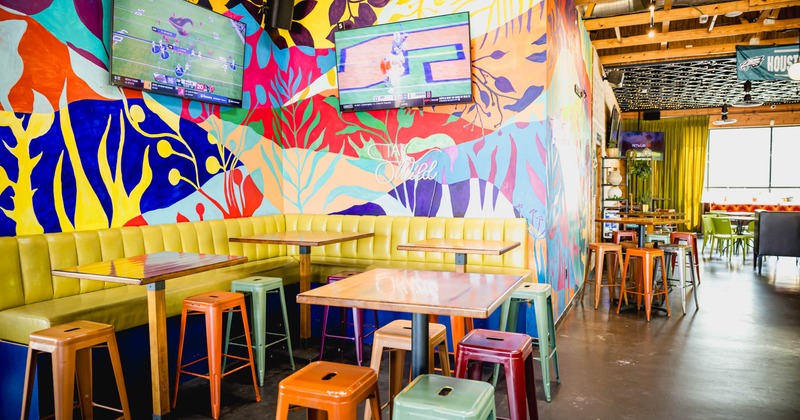 Colorful interior, tall tables and bar stools