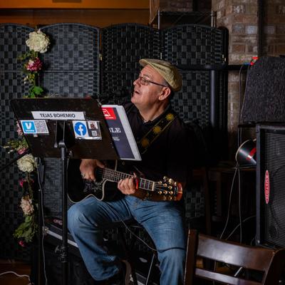 A musician playing the guitar.