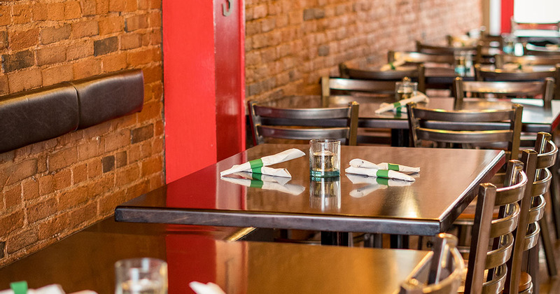 Interior, lined up tables ready for guests