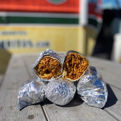 Burritos wrapped in aluminium foil.