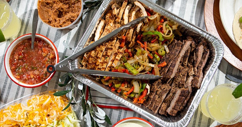 Food and drinks spread on a table, top view