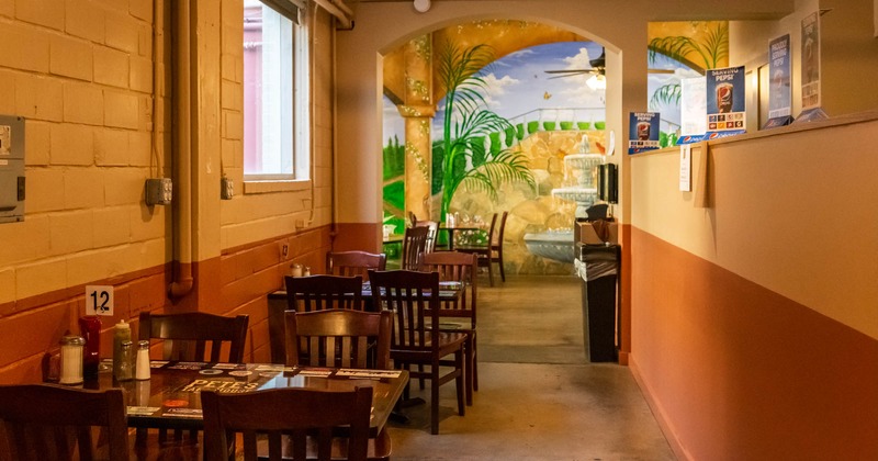 Interior, lined up dining tables for four