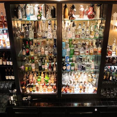 bottles on shelves behind the bar.