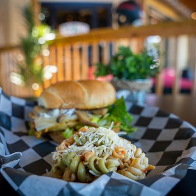 Mushroom and Swiss grilled chicken sandwich, served with pasta salad.