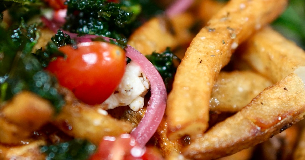 Venus in Fries, French Fries with kale, tomatoes and cheese