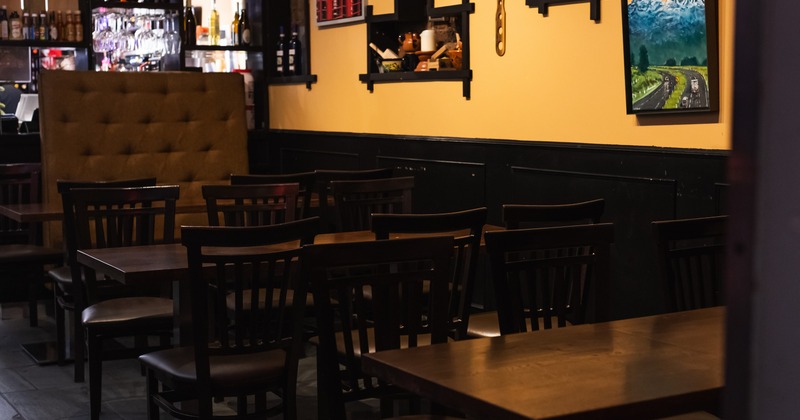 Dining space with paintings on the wall