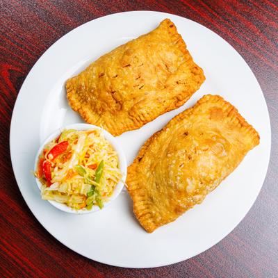 Chicken Pattie meat pies srved with pickled cabbage.