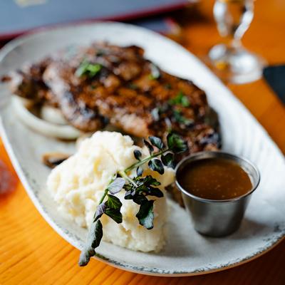 Grilled steak with mashed potatoes.