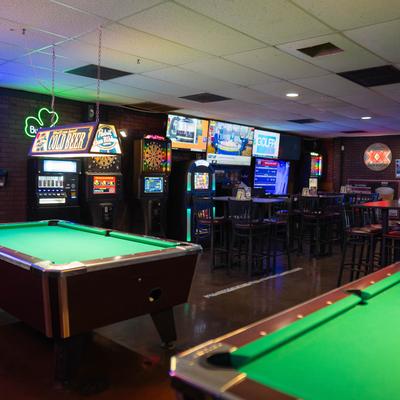 Pool room with pool tables.