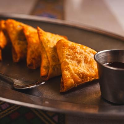 Sambusa pastry shells filled with meat or vegetables, and spices.