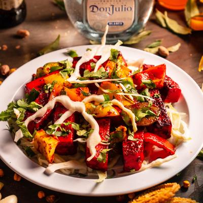 Grilled chunks of paneer marinated in spices, served on the table with drinks