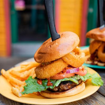 Burger with onion rings and fries.