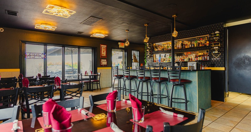 View of a dining area, tables ready for guests