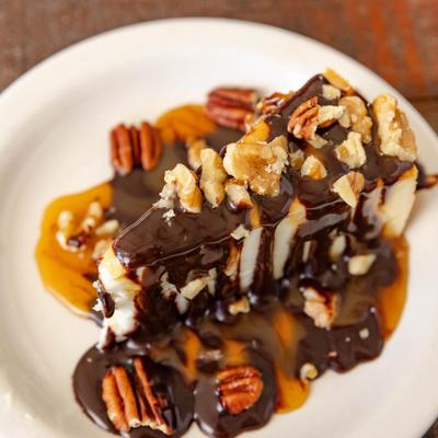 Turtle Cheesecake served on the plate.