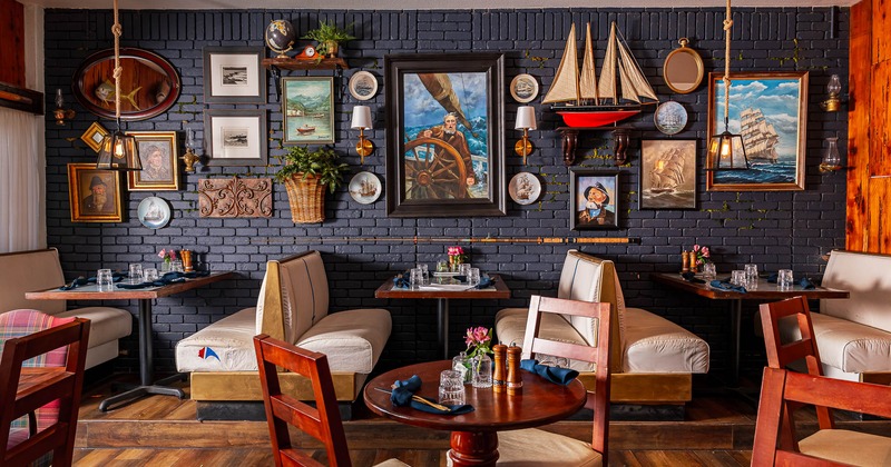 Interior, tables, chairs and restaurant booths in dining area