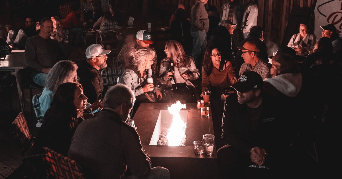 Customers sitting around the fire pit