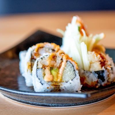 Crazy Maki roll with shrimp tempura, avocado, cucumber, tobiko and spicy mayo.