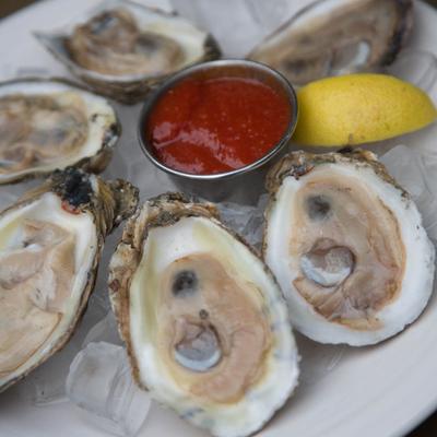 Fresh oysters, with marinara sauce.