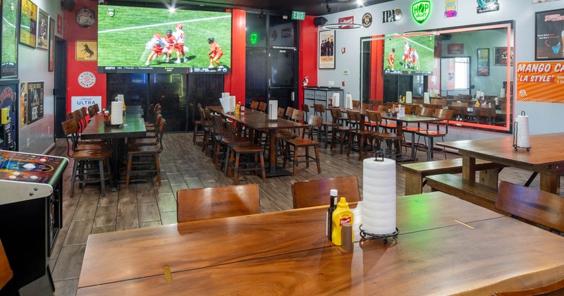 Interior, dining area, long table setups, ready for guests, large projector screen