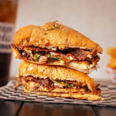 Grilled chicken sandwich, with BBQ sauce, bacon, and veggies.