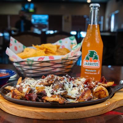 Chicken, steak, and shrimp Fajitas, and Jarritos soda.