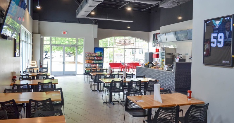 Interior, seating area with tables ready for guests