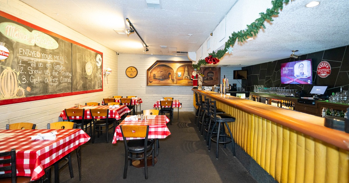 Interior, seating area with a bar on the right