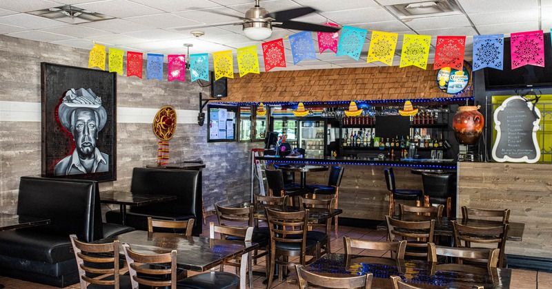 Interior, booths and tables near a bar