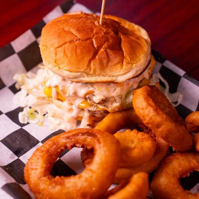 Tailgator Burger with Onion Rings.