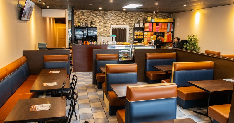 Wide view to diner area, tables and chairs