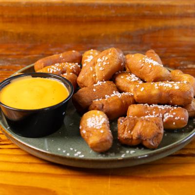 Pretzel bites covered in coarse salt, served with beer cheese dip.