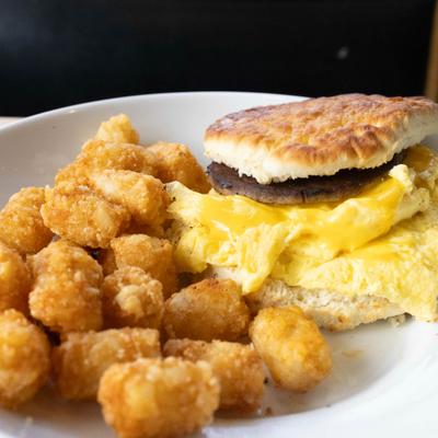 Classic egg and cheese biscuit served with tots.