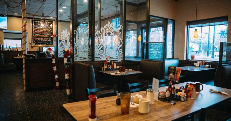 Interior, seating area with booths tables and chairs