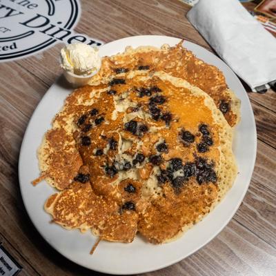 Blueberry pancakes with butter.