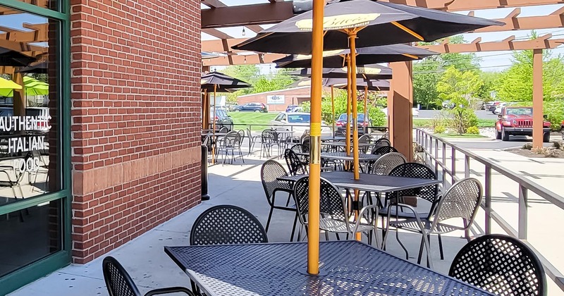 Exterior, patio, tables and chairs with parasols