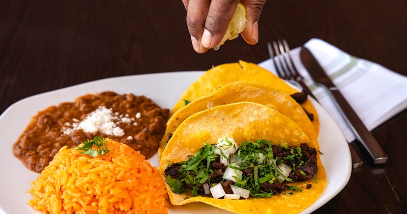 Carne Asada tacos with rice and beans