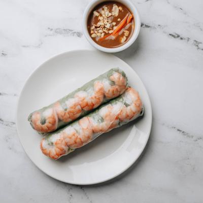 Spring rolls served with dipping sauce.