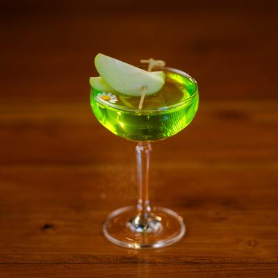 Appletini garnished with apple slices.