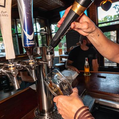 Bartender pouring beer from the tap.