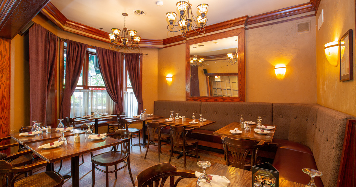 Interior, tables with cutlery and glasses