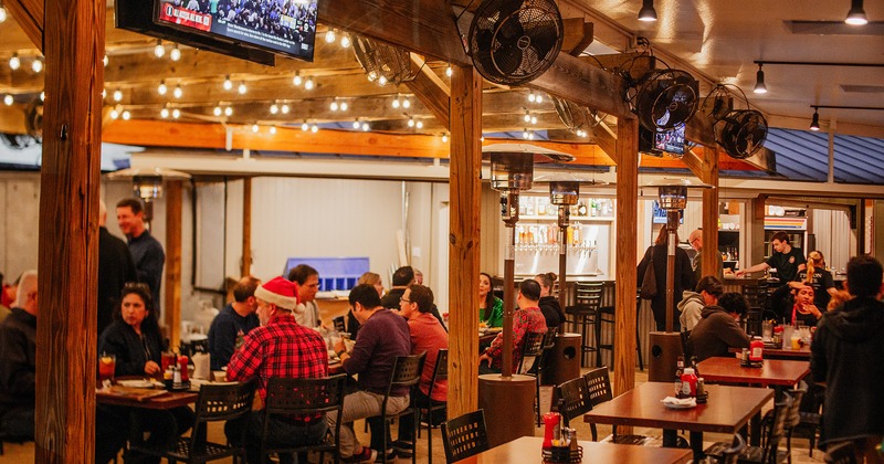 Dining area, guests chatting and enjoying their food and drinks