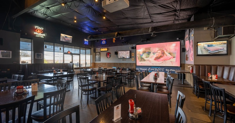 Chairs and tables, TVs on the walls