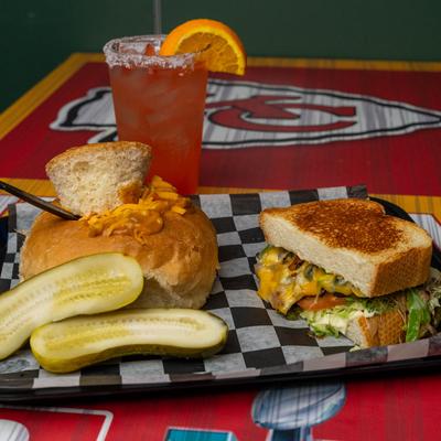 Grilled veggie sandwich and a cocktail.