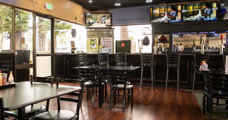 Interior, seating area with a bar in the back