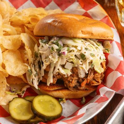 Pulled pork sandwich with coleslaw.