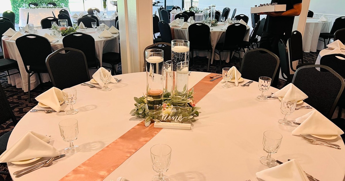 A banquet table set for a wedding reception