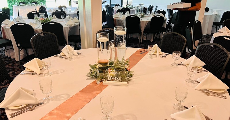 A banquet table set for a wedding reception