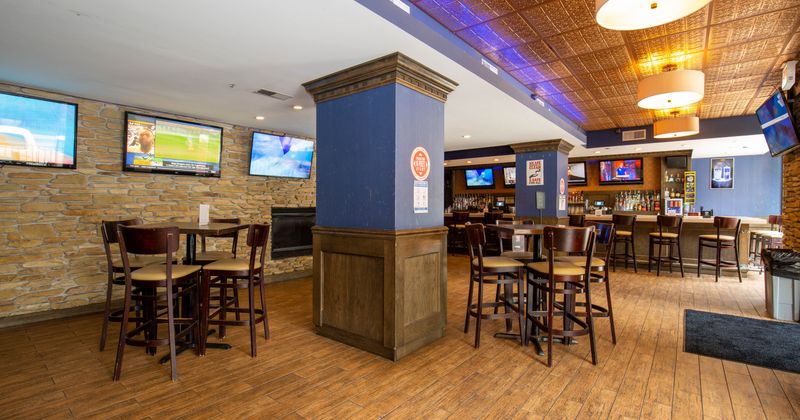 Interior, seating area with bar tables
